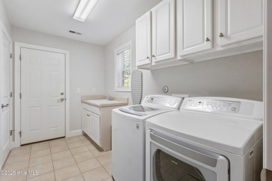 Easy living in this luxury townhome in the highly desirable on Cape Fear National At Brunswick Forest in North Carolina - for sale on GolfHomes.com, golf home, golf lot
