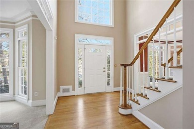 Tucked away on a quiet, double cul-de-sac street is the stately on Brookstone Golf and Country Club in Georgia - for sale on GolfHomes.com, golf home, golf lot