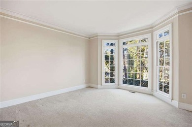 Tucked away on a quiet, double cul-de-sac street is the stately on Brookstone Golf and Country Club in Georgia - for sale on GolfHomes.com, golf home, golf lot