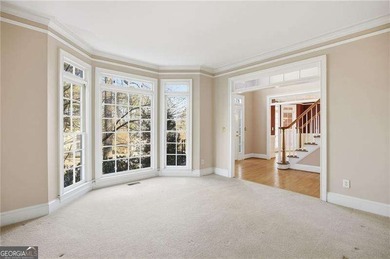 Tucked away on a quiet, double cul-de-sac street is the stately on Brookstone Golf and Country Club in Georgia - for sale on GolfHomes.com, golf home, golf lot