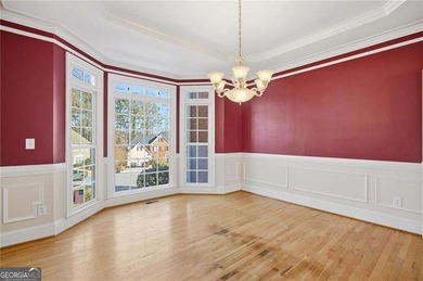 Tucked away on a quiet, double cul-de-sac street is the stately on Brookstone Golf and Country Club in Georgia - for sale on GolfHomes.com, golf home, golf lot