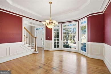 Tucked away on a quiet, double cul-de-sac street is the stately on Brookstone Golf and Country Club in Georgia - for sale on GolfHomes.com, golf home, golf lot