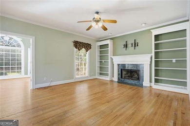 Tucked away on a quiet, double cul-de-sac street is the stately on Brookstone Golf and Country Club in Georgia - for sale on GolfHomes.com, golf home, golf lot