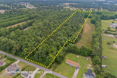 Bring your horses to this sprawling property that backs up to a on The Pines At Elizabeth City in North Carolina - for sale on GolfHomes.com, golf home, golf lot