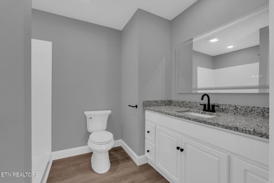 Experience the perfect blend of modern comfort and lakeside on Lake Tansi Village Country Club in Tennessee - for sale on GolfHomes.com, golf home, golf lot