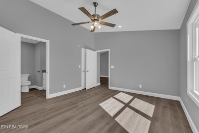 Experience the perfect blend of modern comfort and lakeside on Lake Tansi Village Country Club in Tennessee - for sale on GolfHomes.com, golf home, golf lot