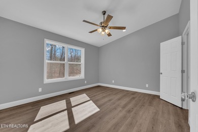 Experience the perfect blend of modern comfort and lakeside on Lake Tansi Village Country Club in Tennessee - for sale on GolfHomes.com, golf home, golf lot