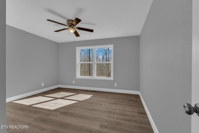 Experience the perfect blend of modern comfort and lakeside on Lake Tansi Village Country Club in Tennessee - for sale on GolfHomes.com, golf home, golf lot