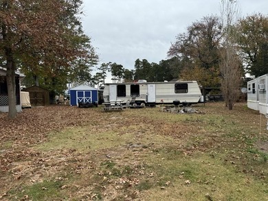 Oversized cul de sac lot with nice shed and camper on site on Captains Cove Golf and Yacht Club in Virginia - for sale on GolfHomes.com, golf home, golf lot
