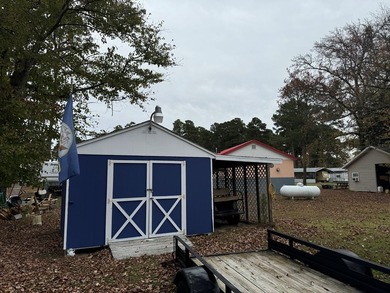 Oversized cul de sac lot with nice shed and camper on site on Captains Cove Golf and Yacht Club in Virginia - for sale on GolfHomes.com, golf home, golf lot