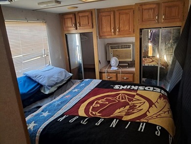 Oversized cul de sac lot with nice shed and camper on site on Captains Cove Golf and Yacht Club in Virginia - for sale on GolfHomes.com, golf home, golf lot