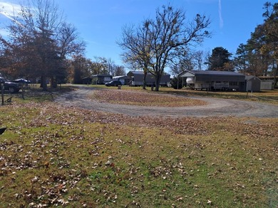Oversized cul de sac lot with nice shed and camper on site on Captains Cove Golf and Yacht Club in Virginia - for sale on GolfHomes.com, golf home, golf lot
