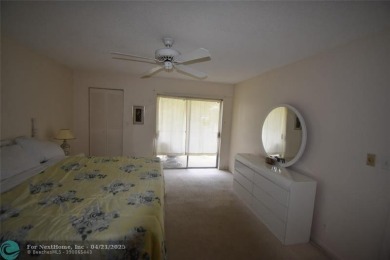 Discover convenience, and scenic beauty in this lovely 2-bedroom on Inverrary Country Club in Florida - for sale on GolfHomes.com, golf home, golf lot