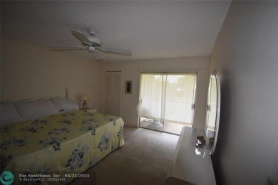 Discover convenience, and scenic beauty in this lovely 2-bedroom on Inverrary Country Club in Florida - for sale on GolfHomes.com, golf home, golf lot