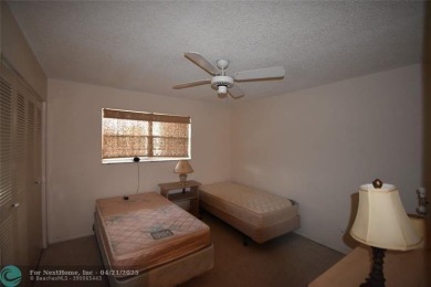 Discover convenience, and scenic beauty in this lovely 2-bedroom on Inverrary Country Club in Florida - for sale on GolfHomes.com, golf home, golf lot