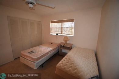 Discover convenience, and scenic beauty in this lovely 2-bedroom on Inverrary Country Club in Florida - for sale on GolfHomes.com, golf home, golf lot