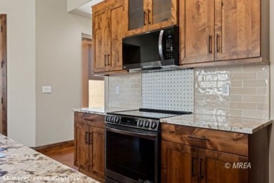 Discover modern desert living at 479 Apogee CRST!! This stunning on Falcon Ridge Golf Course in Nevada - for sale on GolfHomes.com, golf home, golf lot