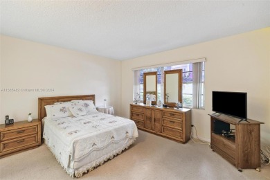 This spacious one bedroom, one-and-a-half-bathroom unit has a on Flamingo Lakes Country Club in Florida - for sale on GolfHomes.com, golf home, golf lot