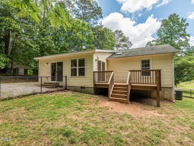 Welcome to Lake Royale! This adorable 3-bedroom home is situated on River Golf and County Club at Lake Royale in North Carolina - for sale on GolfHomes.com, golf home, golf lot