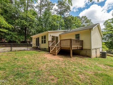 Welcome to Lake Royale! This adorable 3-bedroom home is situated on River Golf and County Club at Lake Royale in North Carolina - for sale on GolfHomes.com, golf home, golf lot