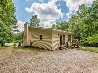 Welcome to Lake Royale! This adorable 3-bedroom home is situated on River Golf and County Club at Lake Royale in North Carolina - for sale on GolfHomes.com, golf home, golf lot