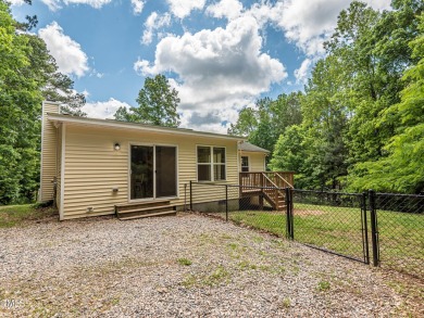 Welcome to Lake Royale! This adorable 3-bedroom home is situated on River Golf and County Club at Lake Royale in North Carolina - for sale on GolfHomes.com, golf home, golf lot