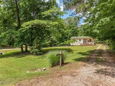 Welcome to Lake Royale! This adorable 3-bedroom home is situated on River Golf and County Club at Lake Royale in North Carolina - for sale on GolfHomes.com, golf home, golf lot