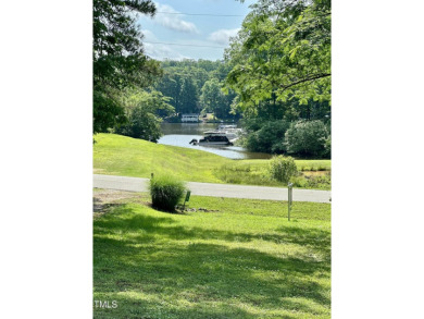 Welcome to Lake Royale! This adorable 3-bedroom home is situated on River Golf and County Club at Lake Royale in North Carolina - for sale on GolfHomes.com, golf home, golf lot