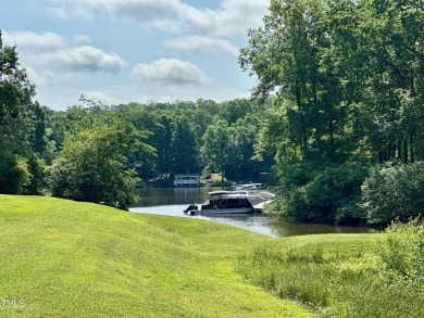 Welcome to Lake Royale! This adorable 3-bedroom home is situated on River Golf and County Club at Lake Royale in North Carolina - for sale on GolfHomes.com, golf home, golf lot
