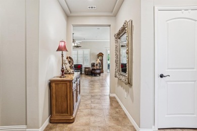 This delightful 2-bedroom home with a study and 2.5 baths is on Wildhorse Golf Club of Robson Ranch in Texas - for sale on GolfHomes.com, golf home, golf lot