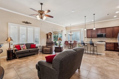 This delightful 2-bedroom home with a study and 2.5 baths is on Wildhorse Golf Club of Robson Ranch in Texas - for sale on GolfHomes.com, golf home, golf lot
