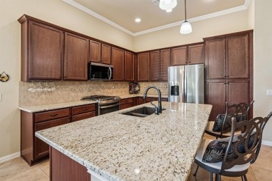 This delightful 2-bedroom home with a study and 2.5 baths is on Wildhorse Golf Club of Robson Ranch in Texas - for sale on GolfHomes.com, golf home, golf lot