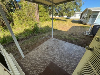 Discover this well maintained manufactured home located in the on Schalamar Creek Golf and Country Club in Florida - for sale on GolfHomes.com, golf home, golf lot