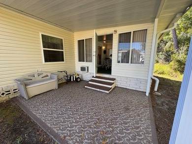 Discover this well maintained manufactured home located in the on Schalamar Creek Golf and Country Club in Florida - for sale on GolfHomes.com, golf home, golf lot