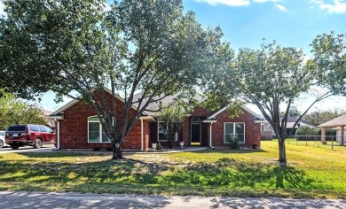 Discover this charming 3-bedroom, 2-bath home on a peaceful on Pecan Plantation Country Club in Texas - for sale on GolfHomes.com, golf home, golf lot