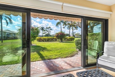 Enjoy picturesque views of the lush golf course and serene on Quail Ridge Golf Course and Country Club in Florida - for sale on GolfHomes.com, golf home, golf lot