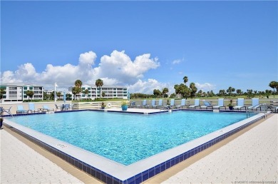 Expansive views of the resort's golf course  ponds. This on Ocean Club At the Hutchinson Island Beach Resort and Marina in Florida - for sale on GolfHomes.com, golf home, golf lot