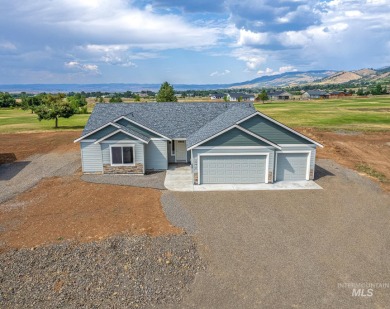 This newly constructed 3-car single level home sits right on the on Council Mountain Golf Course in Idaho - for sale on GolfHomes.com, golf home, golf lot