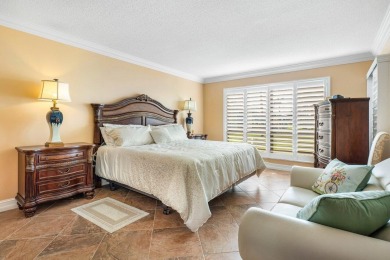 Enjoy picturesque views of the lush golf course and serene on Quail Ridge Golf Course and Country Club in Florida - for sale on GolfHomes.com, golf home, golf lot