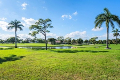 Enjoy picturesque views of the lush golf course and serene on Quail Ridge Golf Course and Country Club in Florida - for sale on GolfHomes.com, golf home, golf lot