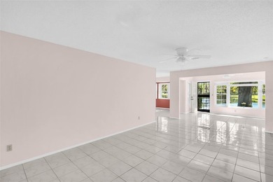 Sought out Villa located on a tranquil and serene pond front lot on Highland Lakes Executive Golf Course in Florida - for sale on GolfHomes.com, golf home, golf lot