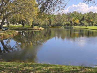 Sought out Villa located on a tranquil and serene pond front lot on Highland Lakes Executive Golf Course in Florida - for sale on GolfHomes.com, golf home, golf lot