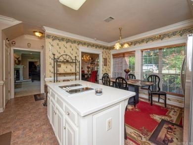 Step into timeless luxury with this 4-bed, 4-bath, 3-car garage on Maumelle Golf and Country Club in Arkansas - for sale on GolfHomes.com, golf home, golf lot