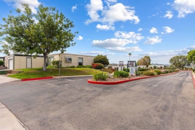Set on an elevated corner lot in Oceana--Oceanside's premier 55+ on Emerald Isle Golf Course in California - for sale on GolfHomes.com, golf home, golf lot