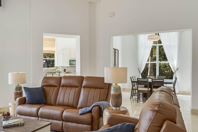 Enjoy the finest of Florida living in this stunning single-story on Ironhorse Country Club in Florida - for sale on GolfHomes.com, golf home, golf lot