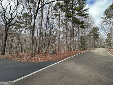 This gently sloping ~3/4-acre homesite is perfectly positioned on Big Canoe Golf Club - Cherokee in Georgia - for sale on GolfHomes.com, golf home, golf lot