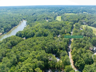 This beautiful, wooded lot on Snug Harbor in The Landing is the on Reynolds Lake Oconee - The Landing in Georgia - for sale on GolfHomes.com, golf home, golf lot