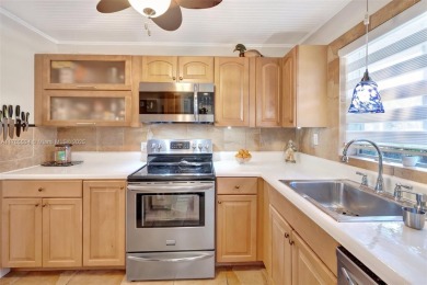 Stunning 1-bedroom, 1.5-bathroom ground-floor unit with a on Sunrise Lakes Phase III in Florida - for sale on GolfHomes.com, golf home, golf lot