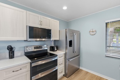 TURN KEY READY! Updated corner unit w/extra natural light & on  in Florida - for sale on GolfHomes.com, golf home, golf lot