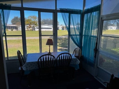 This approx 1200 sf 1990 2 bedroom 2 bath home is located in the on Lake Henry Golf Club in Florida - for sale on GolfHomes.com, golf home, golf lot